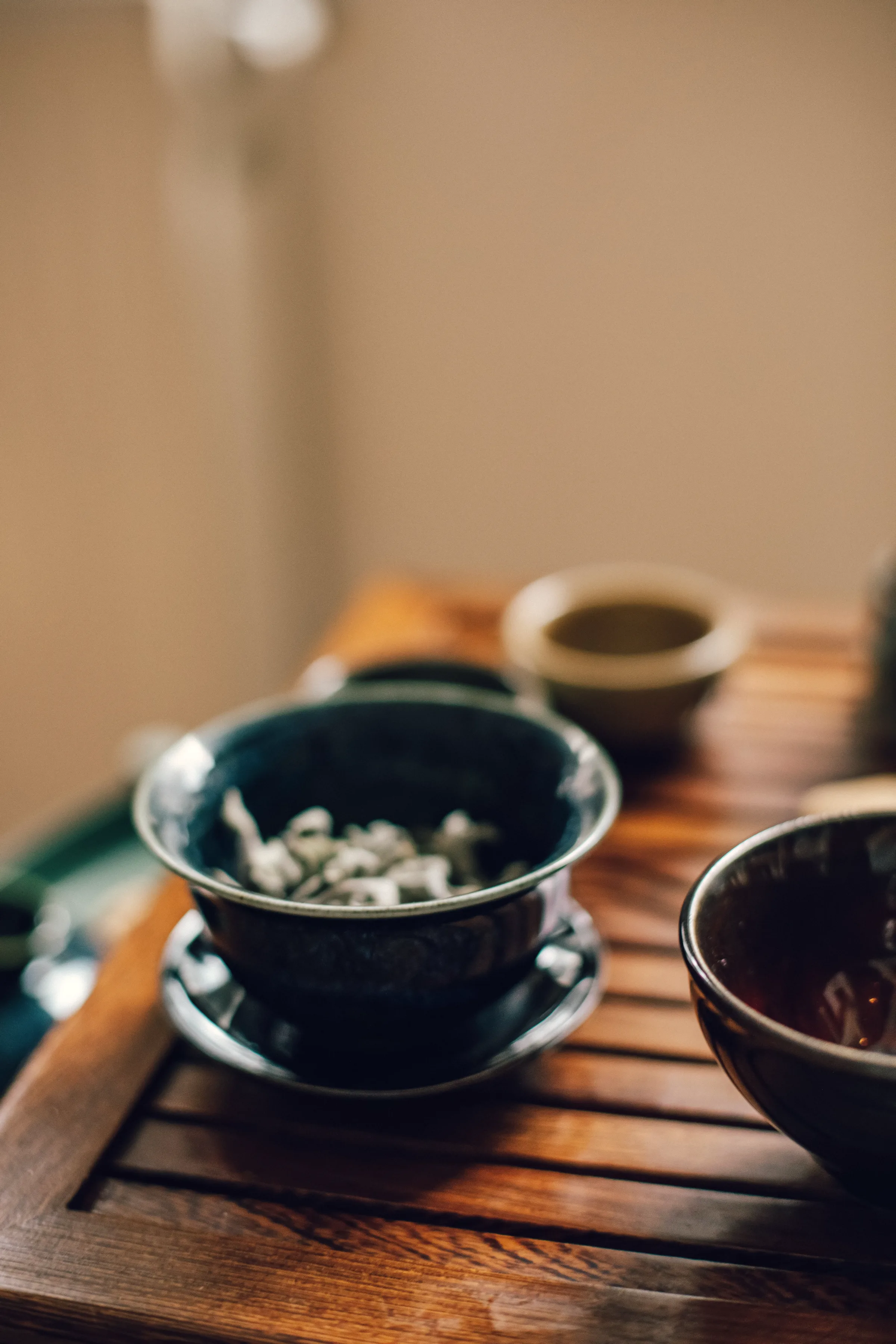 Tea leaves unfurling in a glass