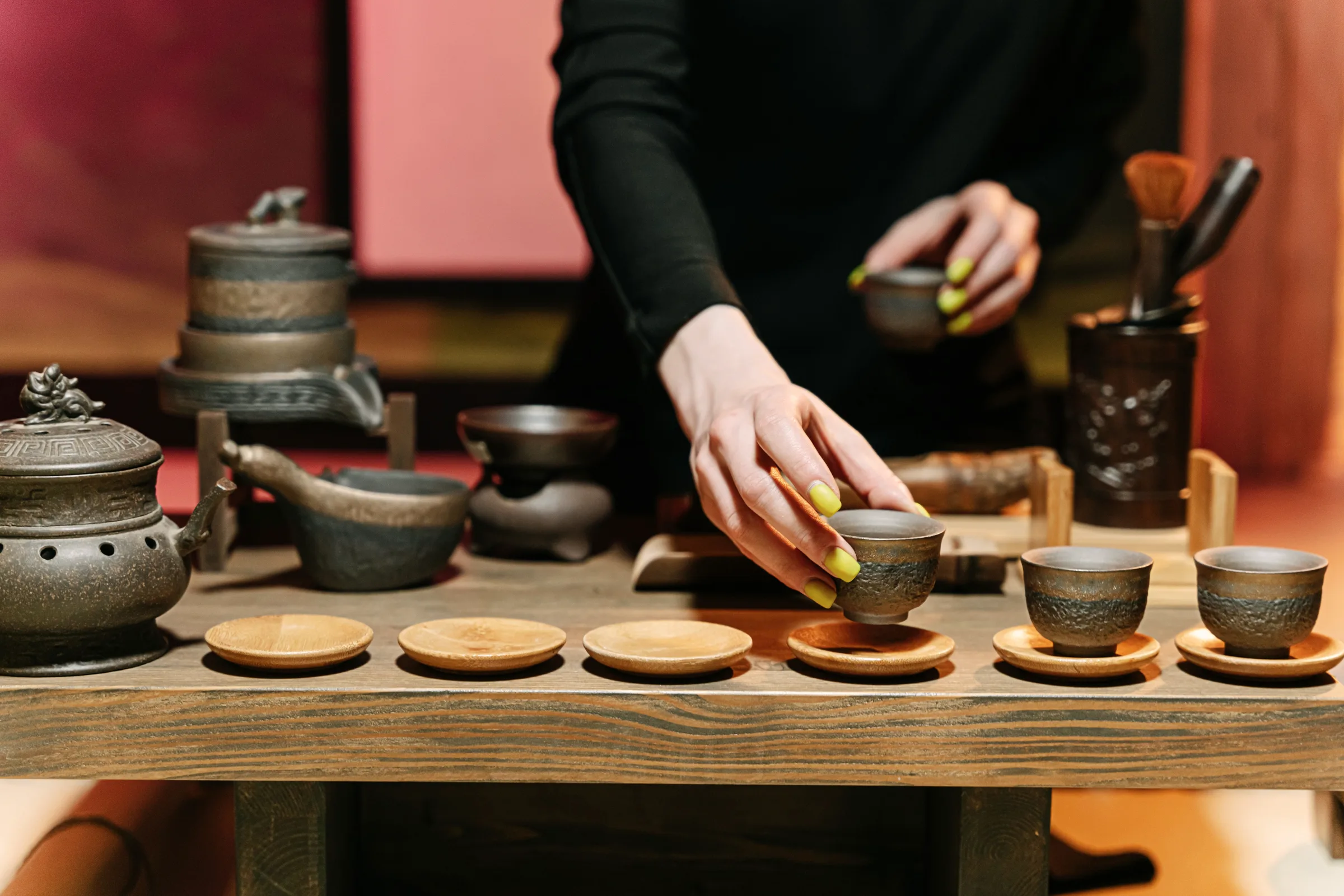Small dishes and teacups crowded on a round table